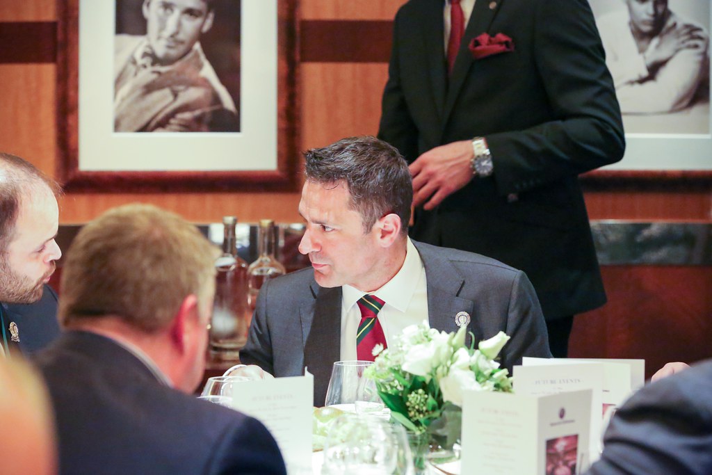 A member in conversation at dinner